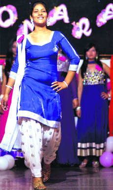 A girl walks down the ramp during a farewell party at the Guru Nanak Khalsa College for Women,on the  Gujarkhan campus. 