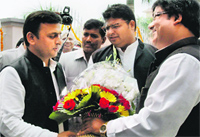 Uttar Pradesh Chief Minister Akhilesh Yadav being greeted on completing one year in office, in Lucknow on Friday.  PTI