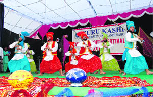 Students perform bhangra at the annual function of Guru Kashi University on Saturday.