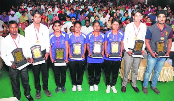 Students who received awards pose with their trophies during the function on Saturday. 