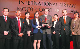The winning team of the China University of Law and Political Science with the trophy at Abu Dhabi. 