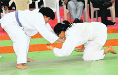 Participants in action during the All-India Inter-University Women Judo Championship at Panjab University in Chandigarh on Saturday.