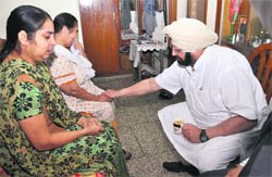 Capt Amarinder Singh at the victims residence in Phase III-A, Mohali, on Saturday.