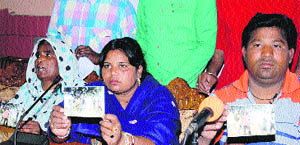Residents of Kalyanpur village talk to media in favour of the SHO of the Lambra police station in Jalandhar on Saturday. 