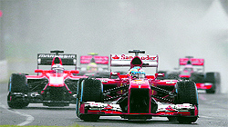 Ferraris Fernando Alonso of Spain (front) drives during the qualifying session of the Australian F1 Grand Prix at the Albert Park circuit in Melbourne on Saturday