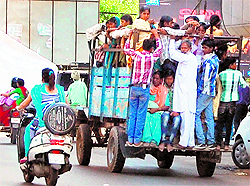 People risk their lives while travelling on a peter rehra in Amritsar
