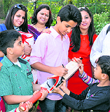 Child actor Ritvik Sahore signs autographs during a visit to Amritsar on Sunday