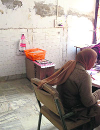 A female staff works at an office, which was once a public toilet, in the District Administrative Complex in Muktsar.