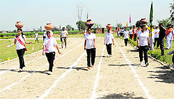 Girls take part in an obstacle race at the eighth annual athletic meet of the Master Mind College of Education on Sunday