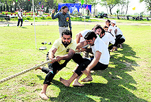 Youths take part in a tug-of-war contest held on the occasion