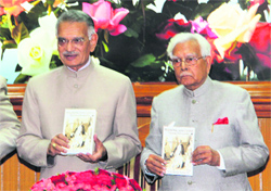 Shivraj Patil, Governor of Punjab and UT Administrator, releases a book, “Walking With Lions”, written by K Natwar Singh (right), at the Punjab Bhawan in Chandigarh.