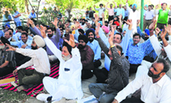 Members of the Sky Rock City Welfare Society, Mohali, protest against Navjeet Singh, president of the society, outside his residence at Sector 69 on Sunday.