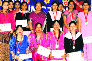 Students with medals and certificates during the annual function at KLDAV PG College in Haridwar. 