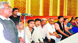 MLA Madan Kaushik addresses party workers in Haridwar on Sunday. 