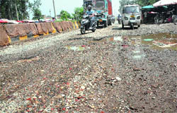A view of the dilapidated strech of the Guru Nanak Pura-Ladowali road near Jalandhar.