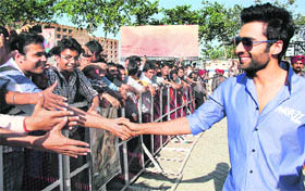 Jackky Bhagnani, actor of Rangrezz, shakes hands with his fans in Jalandhar.