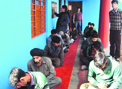 Candidates take a Sakshar Bharat Mission exam in Batote on Sunday. A tribune photograph