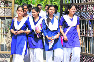 Class XII students come out of an examination centre after appearing for their Hindi exam in Bathinda on Monday. 