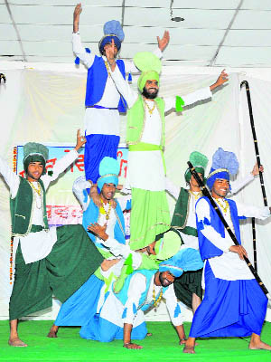 Dancers perform bhangra during the Yuvak Mela organised at the Teachers' Home in Bathinda on Monday. 