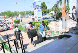 Commuters enter the railway station from the VIP entrance.