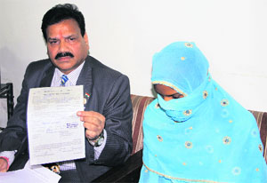 Vice-Chairman of the National Commission for Scheduled Castes Raj Kumar Verka with the minor Dalit girl, who was sold to a Jat, at Circuit House in Jalandhar. 