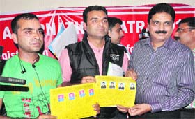 Applicants show their registration slips for the Amarnath yatra in Jammu on Monday
