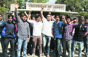 Activists of Panther Students Union protest outside the main gate of University of Jammu on Monday.