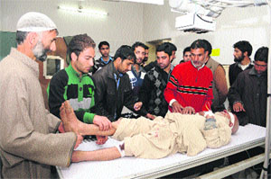 An elderly man who was injured in a road accident in Pulwama district being treated at a Srinagar hospital on Monday.