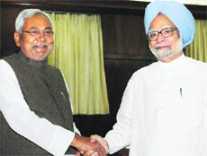 Prime Minister Manmohan Singh with Bihar CM Nitish Kumar at a meeting in New Delhi on Monday. 