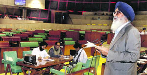 Parkash Singh Badal, CM, delivers his speech on Governor's Address to empty benches. 