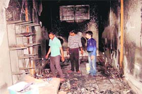 An inside view of the cyber caf, which was burgled and set afire at Nai Basti in Bathinda on Monday night