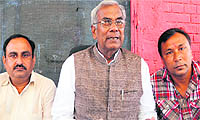 President of the state unit of the Samajwadi Party addresses a press conference in Dehradun on Tuesday