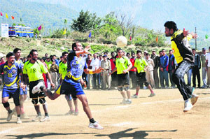 Border Security Force and Himachal Pradesh teams vie for the ball during a handball match of the 61st All-India Cluster Games in Dharamsala on Tuesday.