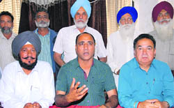Members of the All-Punjab Truck Operators Union address the media in Jalandhar on Tuesday.