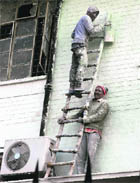 A picture of unsafe mode used by labourers to paint walls in the office of BSNL clicked by Tribune lensman Malkiat Singh prior to the tragedy in Jalandhar on Tuesday.