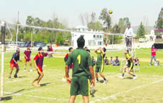 Players in action during a volleyball match at Rajouri on Tuesday. 