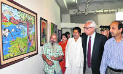 Governor NN Vohra looks at an art work at Kala Kendra in Jammu on Tuesday. 