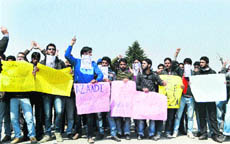 Students protest on the campus of Kashmir University in Srinagar on Tuesday.