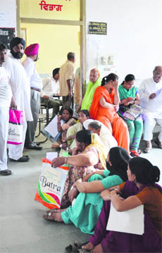 Patients wait for doctors at Lord Mahavir Civil Hospital in Ludhiana. 