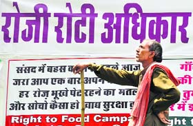 An activist attends a four-day dharna demanding the Food Security Bill providing subsidised foodgrain to the needy at Jantar Mantar in New Delhi on Tuesday