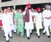 Congress leaders come out of the Vidhan Sabha in Chandigarh on Tuesday.
