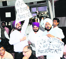 Congress councillors walk out of the House during the Budget meting at Town Hall.