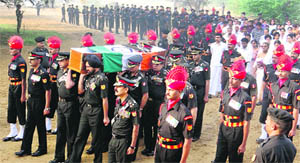 Major-Gen A. Krishnans mortal remains wrapped in the Tricolor being carried for cremation by Army officers at Hisar on Wednesday. 