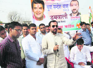 Haryana Youth Congress president Amit Sihag addresses people at Shergarh in Sirsa on Wednesday. 