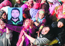 Relatives mourn the killing of Suhail Ahmad Sofi, in Sopore on Wednesday.