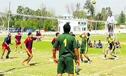 Players in action during a volleyball tournament at Rajouri