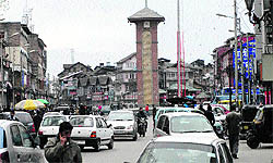 Despite a shutdown call by separatist council Muttahidda Majlis-e-Mushawarat, vehicles ply on a road