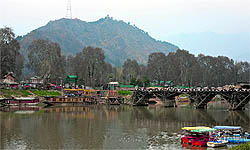 Boats are moored on the banks of the Jhelum in Srinagar