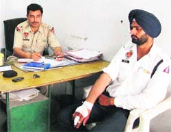 Injured policeman Balraj Singh, who was hit by car-borne youths in Amritsar on Wednesday. 