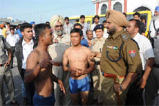 SSP Ravcharan Brar speaks to divers who rescued the occupants of the Gypsy, at the site of the accident. 